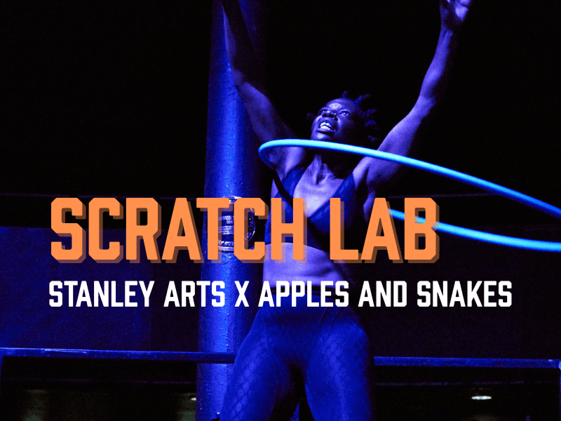A person with short hair is performing with a hula hoop, striking a dynamic pose in a dark, dramatic setting with blue lighting. The text "SCRATCH LAB" is prominently displayed in orange, with "STANLEY ARTS X APPLES AND SNAKES" in white at the bottom of the image. The artist is Kat Francois.