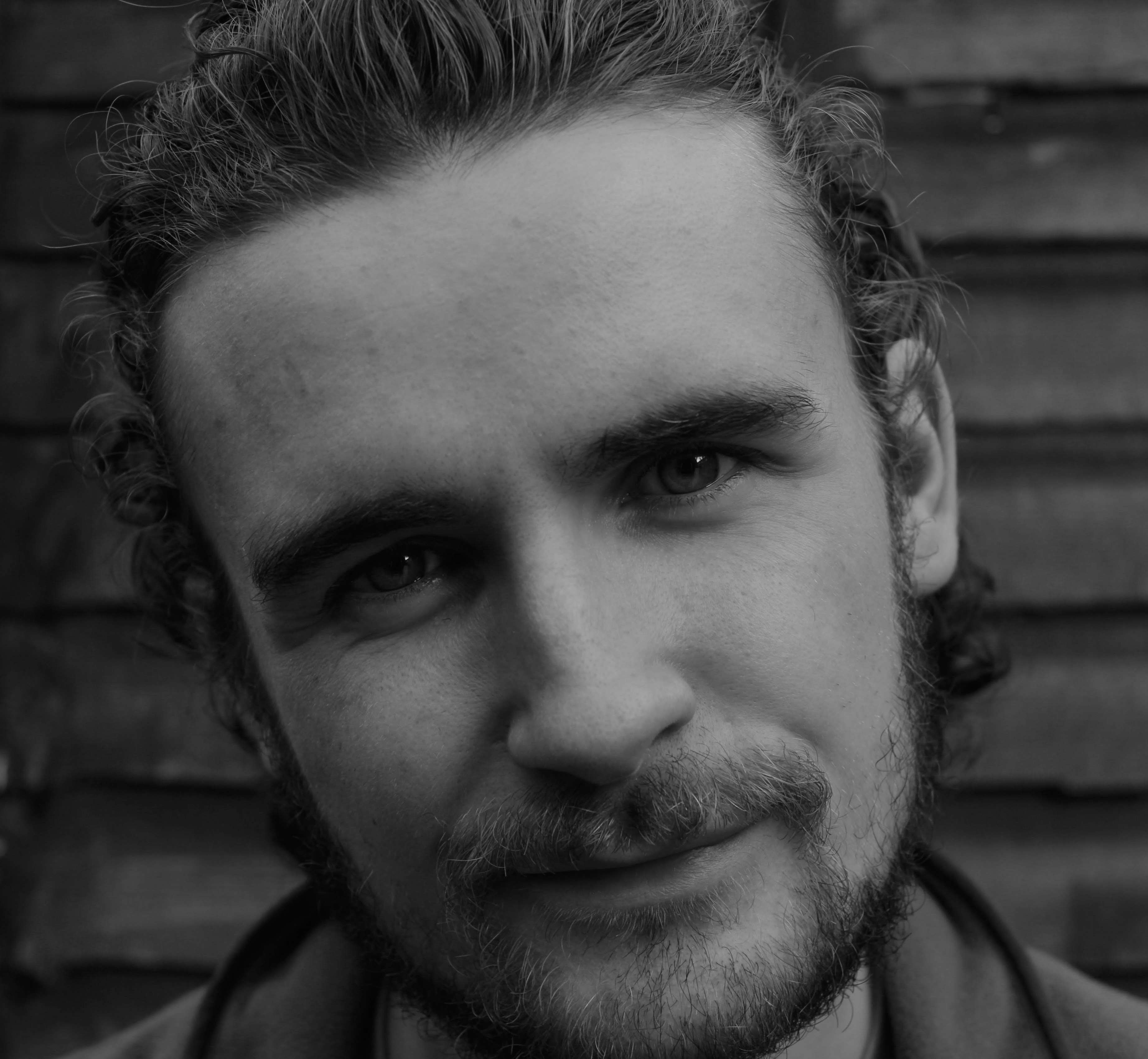 Close up black and white image of shaun hill